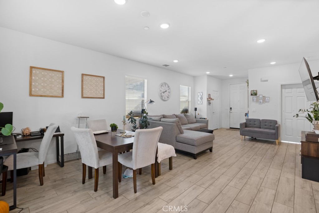 20920 Spring Street Riverside, CA 92507 - Photo 10 of 30 a living room with furniture a wooden floor and a chair