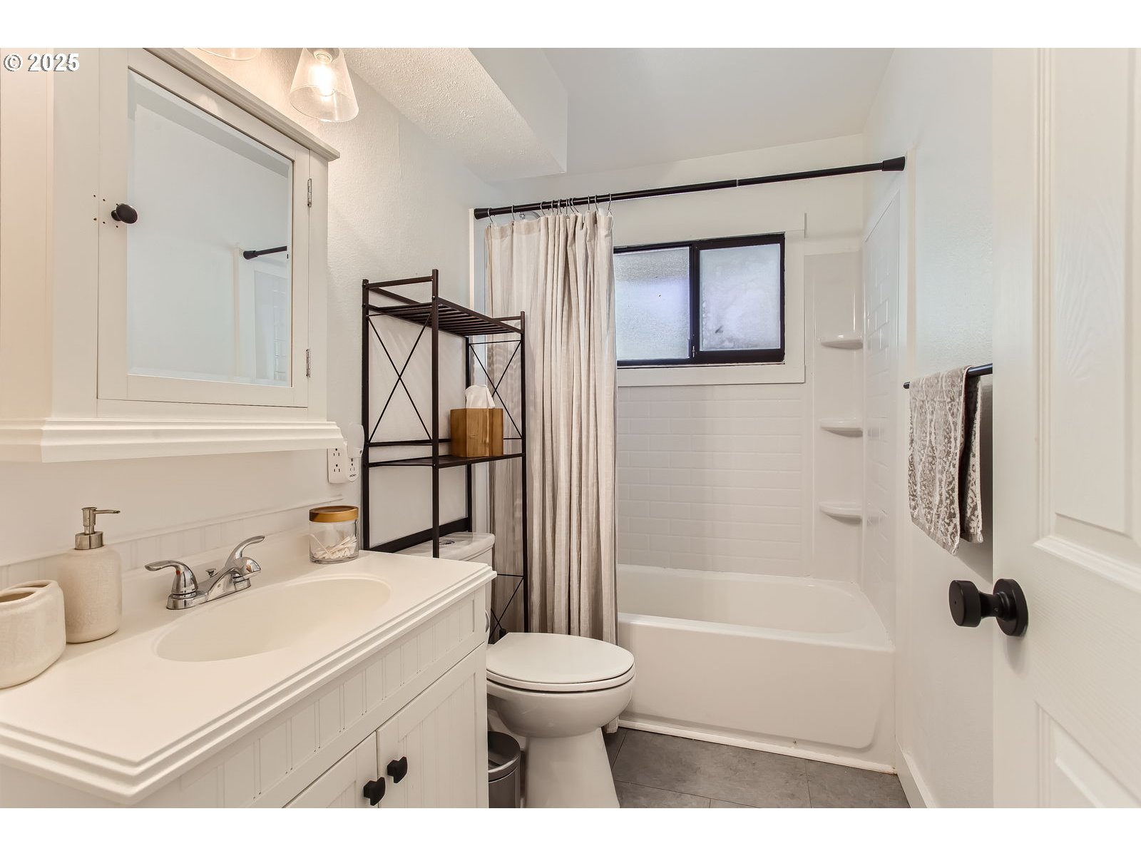 6121 Southwest Wilbard Street Portland, OR 97219 - Photo 23 of 28 a bathroom with a sink toilet and shower