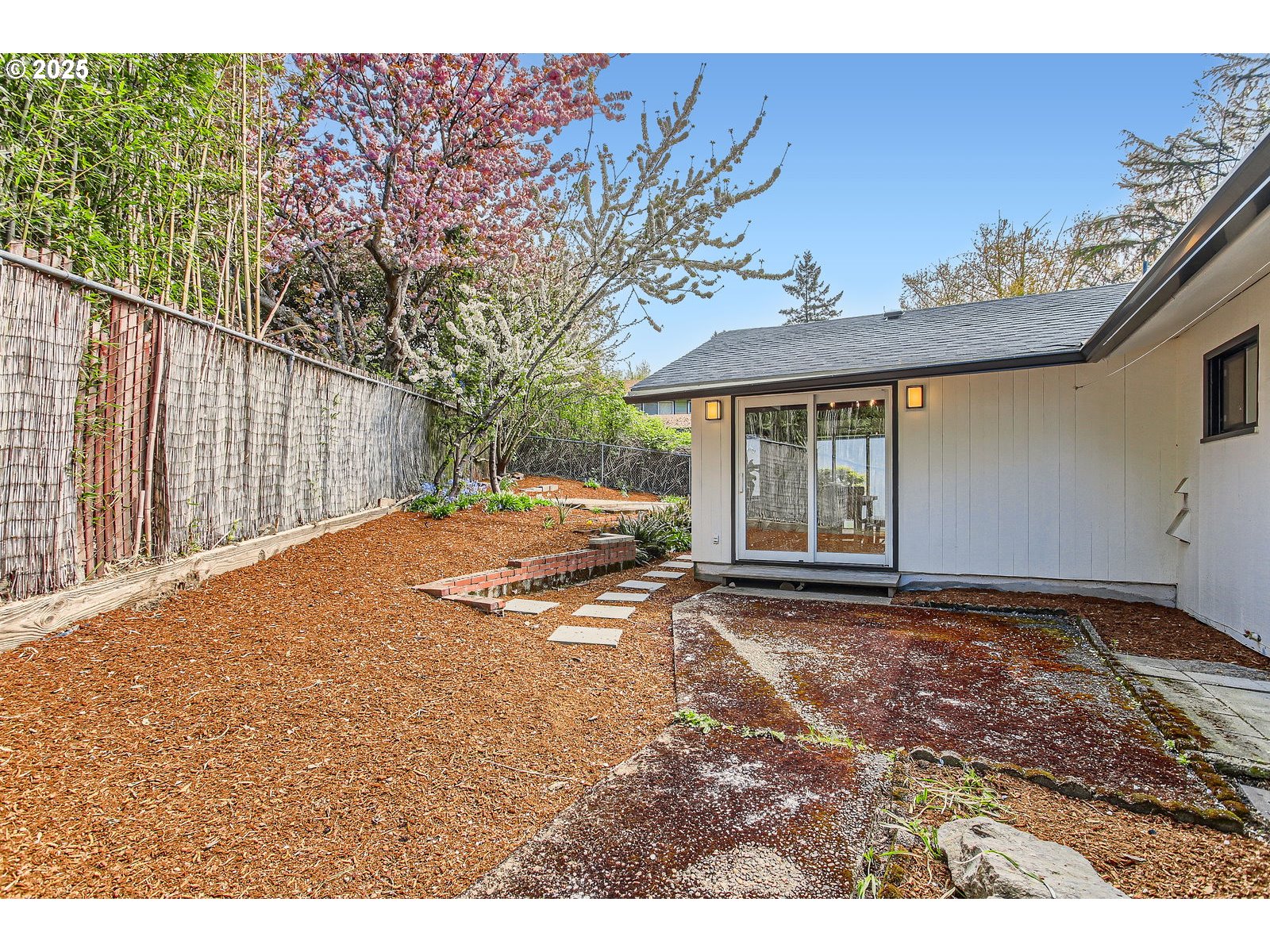 6121 Southwest Wilbard Street Portland, OR 97219 - Photo 26 of 28 a view of a backyard with a garden