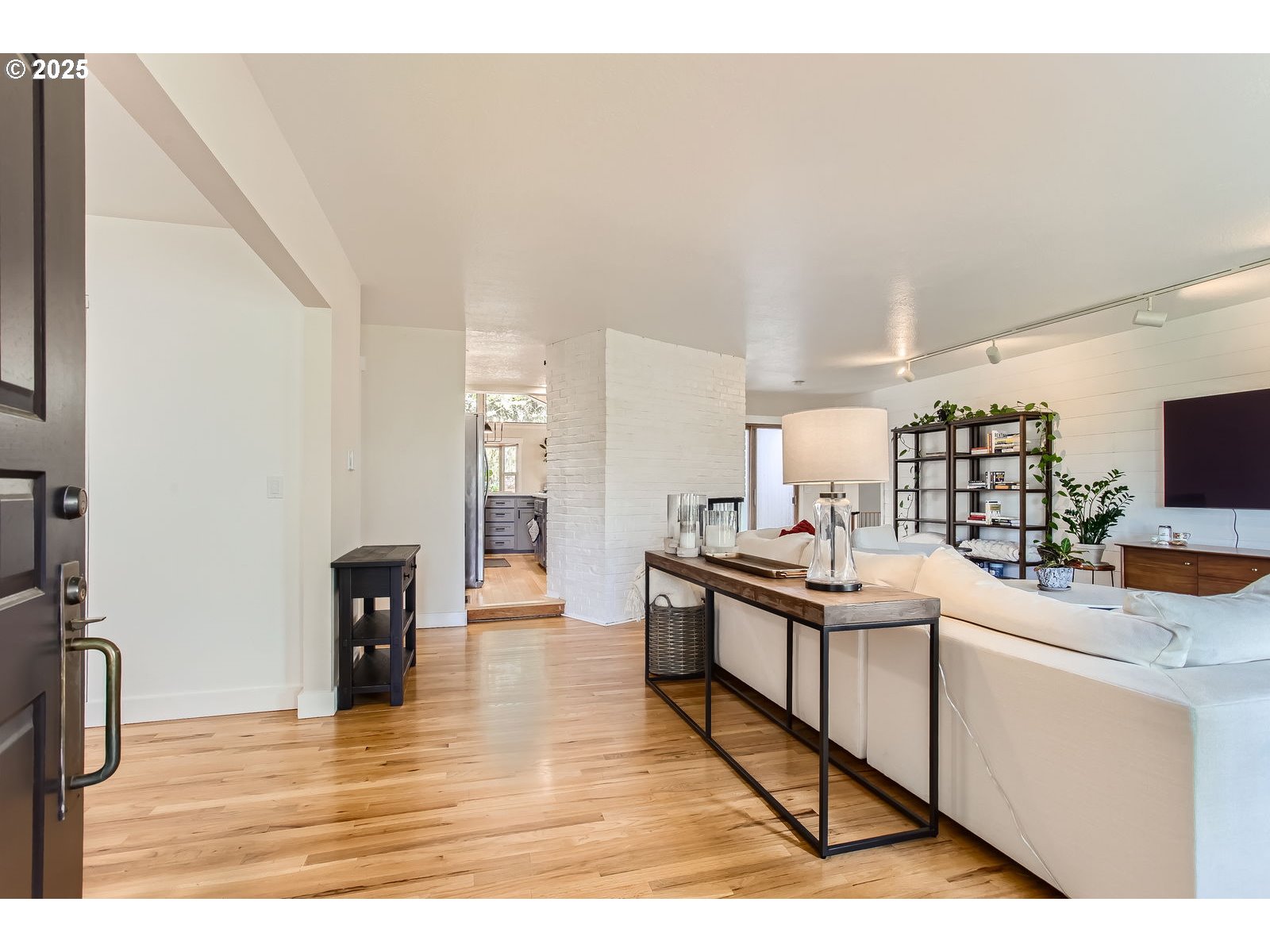 6121 Southwest Wilbard Street Portland, OR 97219 - Photo 4 of 28 a kitchen with stainless steel appliances kitchen island sink refrigerator and stove
