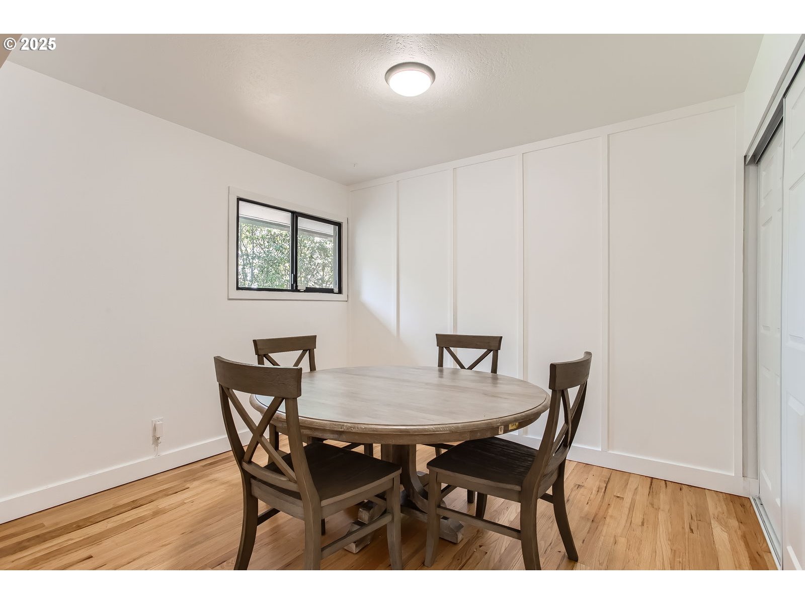 6121 Southwest Wilbard Street Portland, OR 97219 - Photo 8 of 28 a view of a dining room with furniture and wooden floor