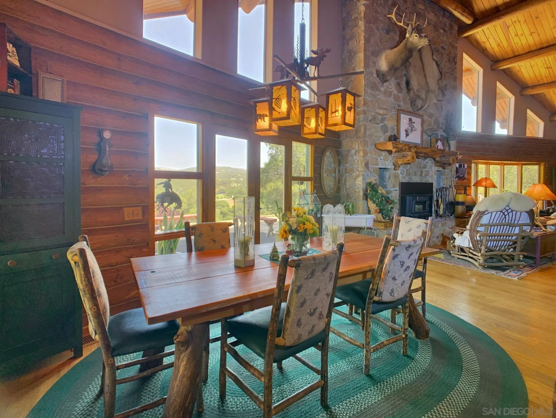 6191 Red Hawk Ridge Alpine, CA 91901 - Photo 13 of 70 a view of a dining room with furniture a chandelier and wooden floor