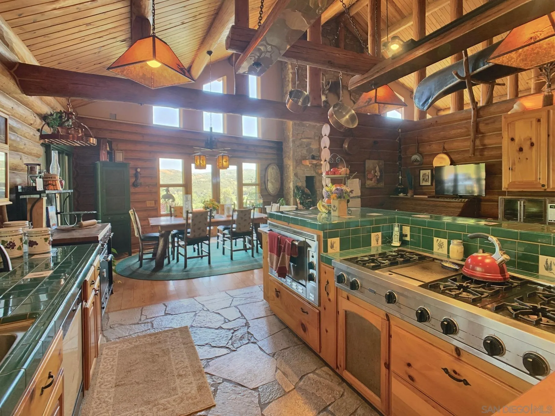 6191 Red Hawk Ridge Alpine, CA 91901 - Photo 14 of 70 a kitchen with stainless steel appliances granite countertop a stove a sink and a wooden floors