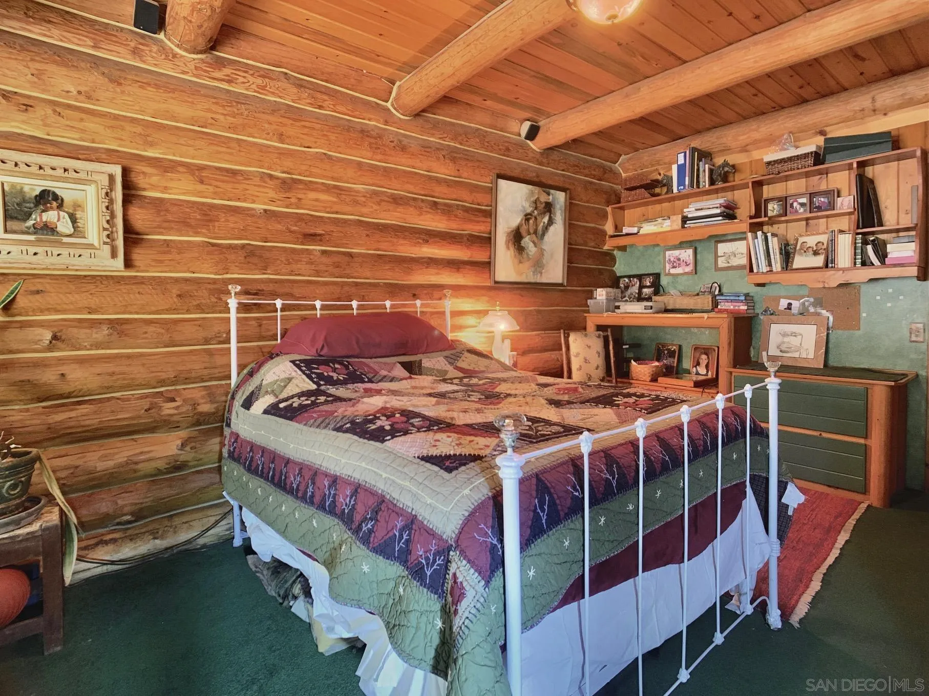 6191 Red Hawk Ridge Alpine, CA 91901 - Photo 21 of 70 a bedroom with a bed and a book shelf