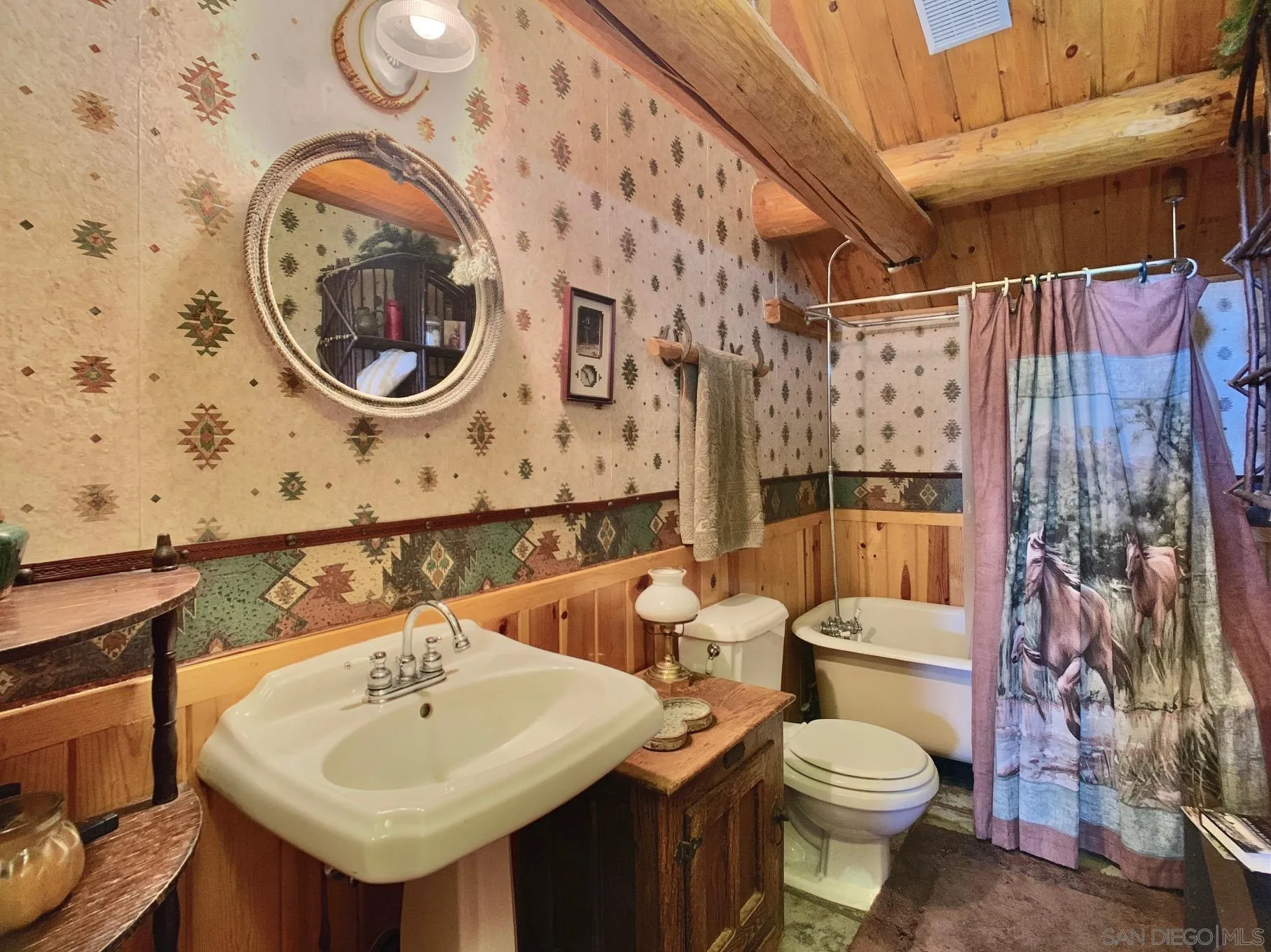 6191 Red Hawk Ridge Alpine, CA 91901 - Photo 47 of 70 a bathroom with a sink and a mirror