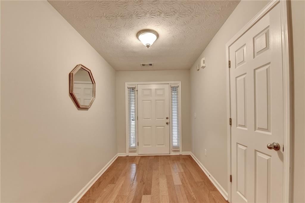 310 Andrew Ridge Drive Jefferson, GA 30549 - Photo 6 of 52 a view of a livingroom with wooden floor and a window