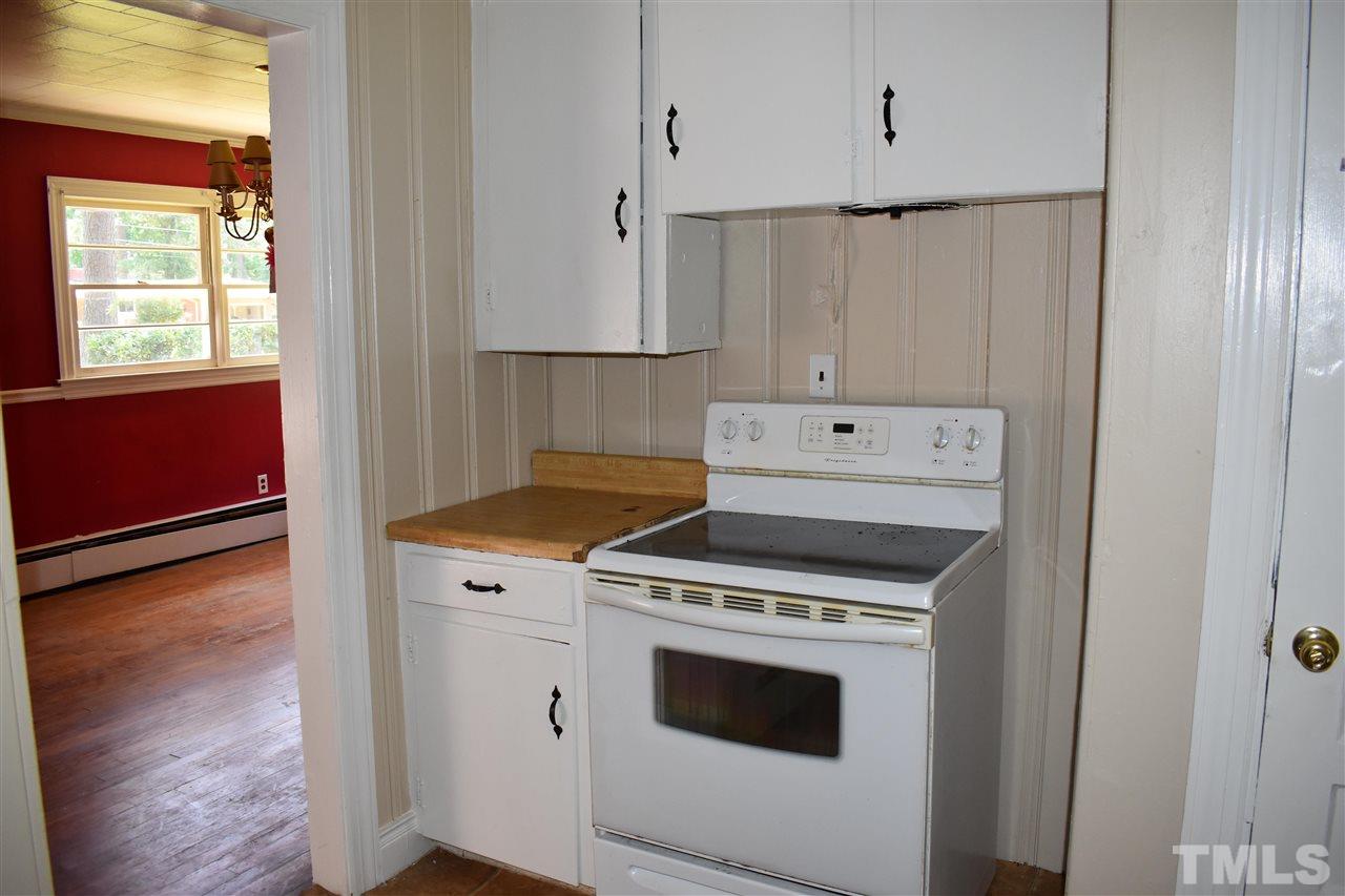 411 Pine Street Smithfield, NC 27577 - Photo 12 of 13 a kitchen with a stove and a microwave