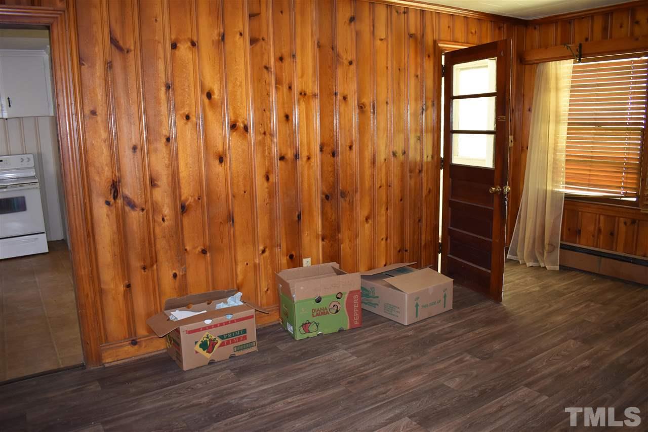 411 Pine Street Smithfield, NC 27577 - Photo 7 of 13 a view of a room with wooden floor and furniture