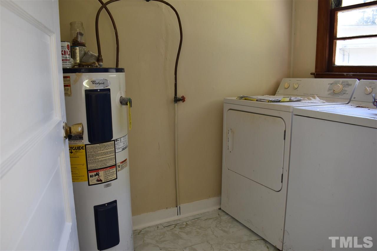 411 Pine Street Smithfield, NC 27577 - Photo 9 of 13 a bathroom with a sink and a mirror