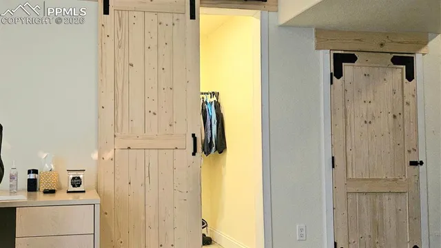 a bathroom with a double vanity sink and a toilet