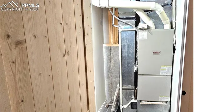 a view of a room with wooden floor and windows