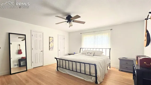 a view of a chairs and table in the balcony
