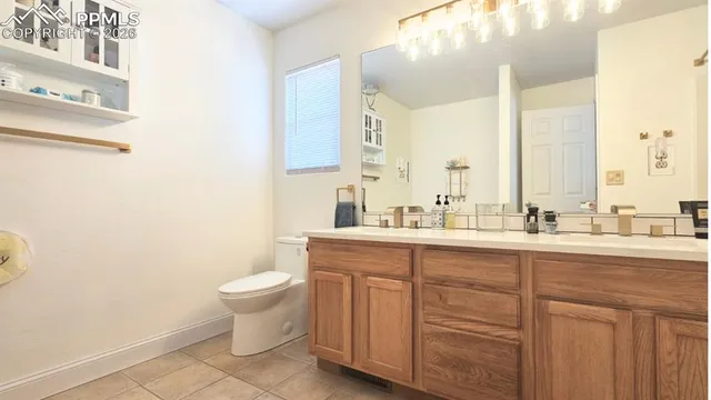 a view of a patio with table and chairs potted plants