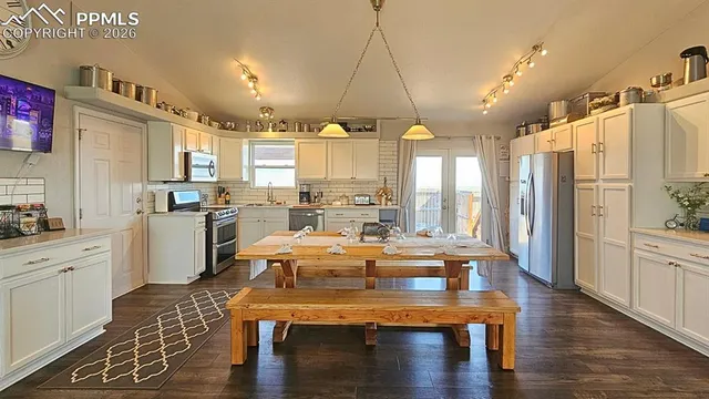 a bed room with a bed and a large window