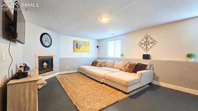 a room with furniture and air hockey table