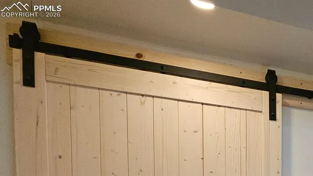 a room with furniture a flat screen tv and a fireplace