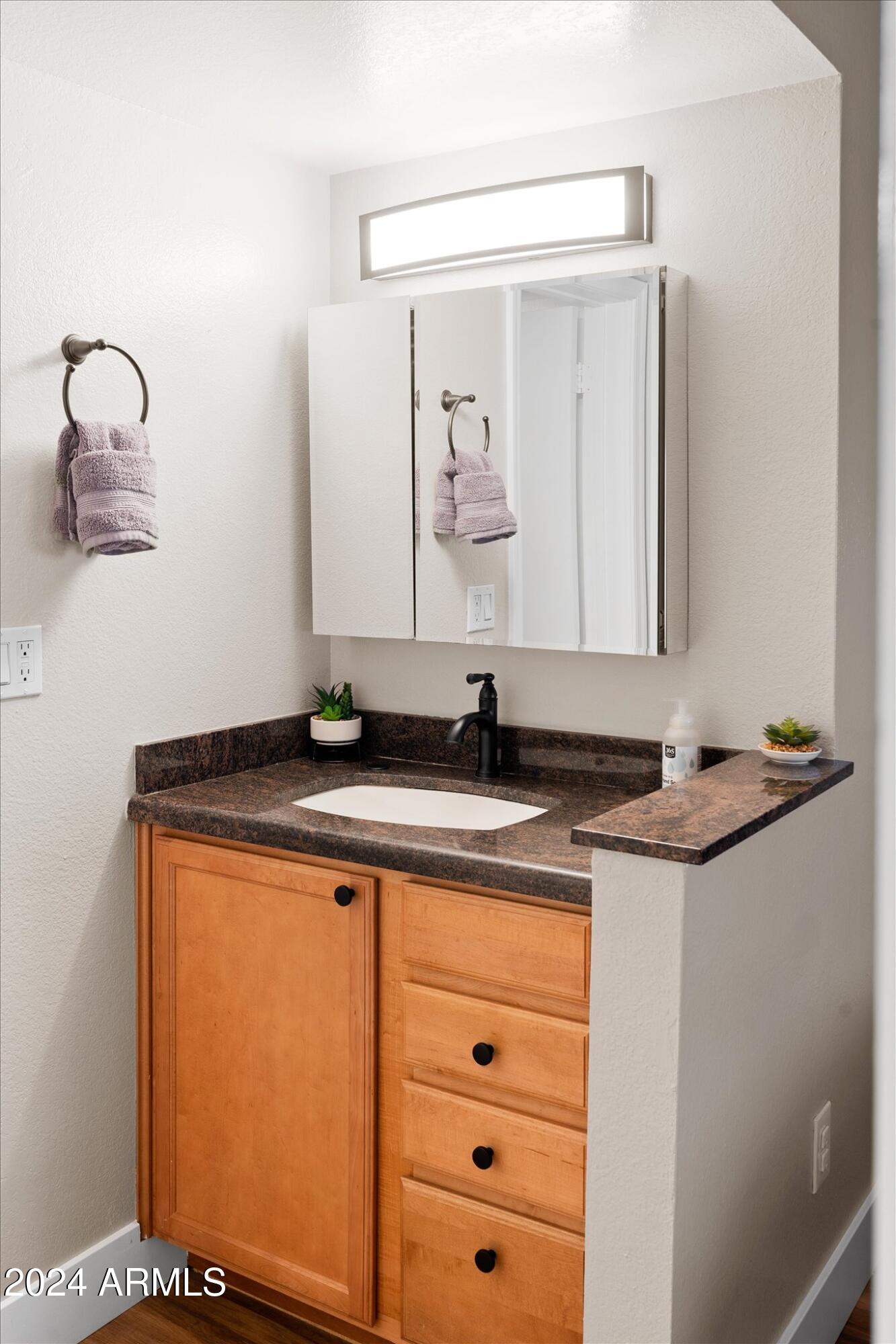 533 West Guadalupe Road, Unit 1063 Mesa, AZ 85210 - Photo 36 of 57 a sink and a mirror