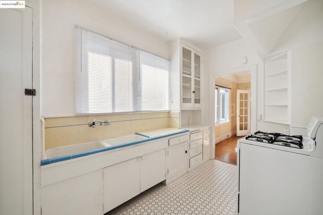 a kitchen with a stove and a sink