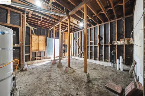 a view of a storage and utility area with a clock