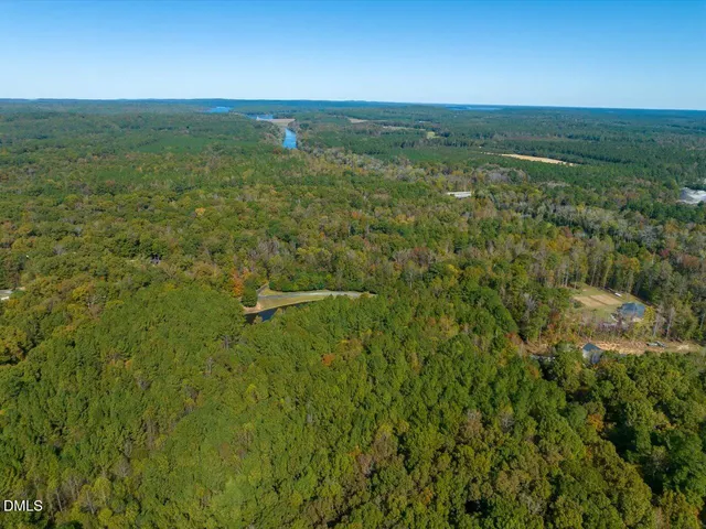 a view of a field with an ocean view