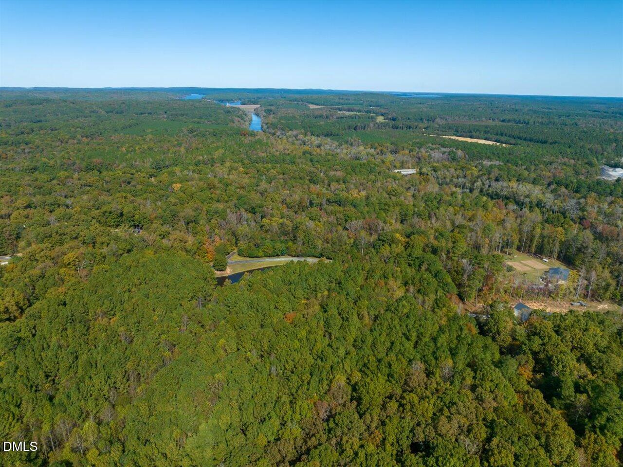 465 Wimberly Road Moncure, NC 27559 - Photo 8 of 13 a view of a field with an ocean view