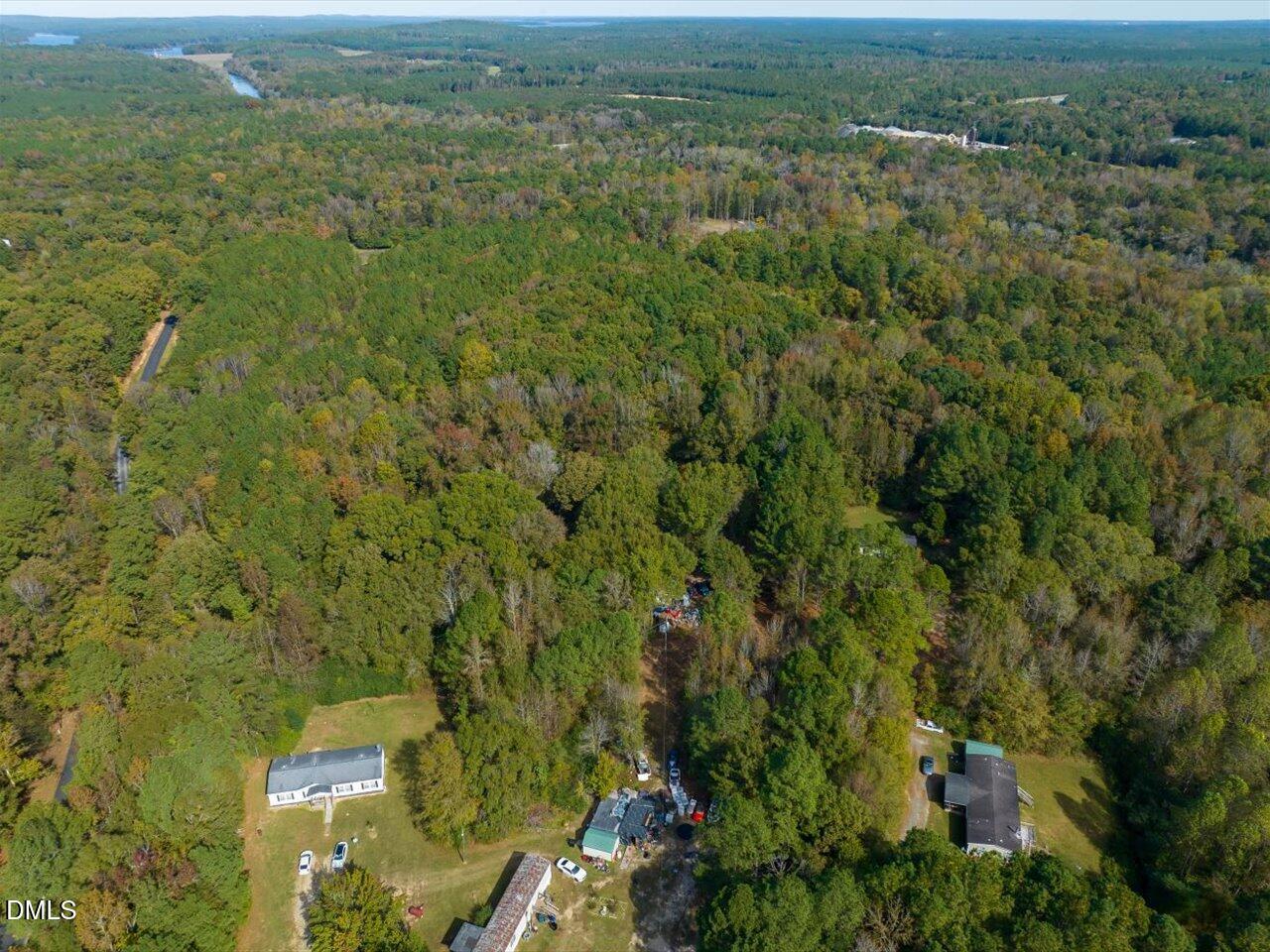 465 Wimberly Road Moncure, NC 27559 - Photo 9 of 13 an aerial view of residential houses with outdoor space and trees
