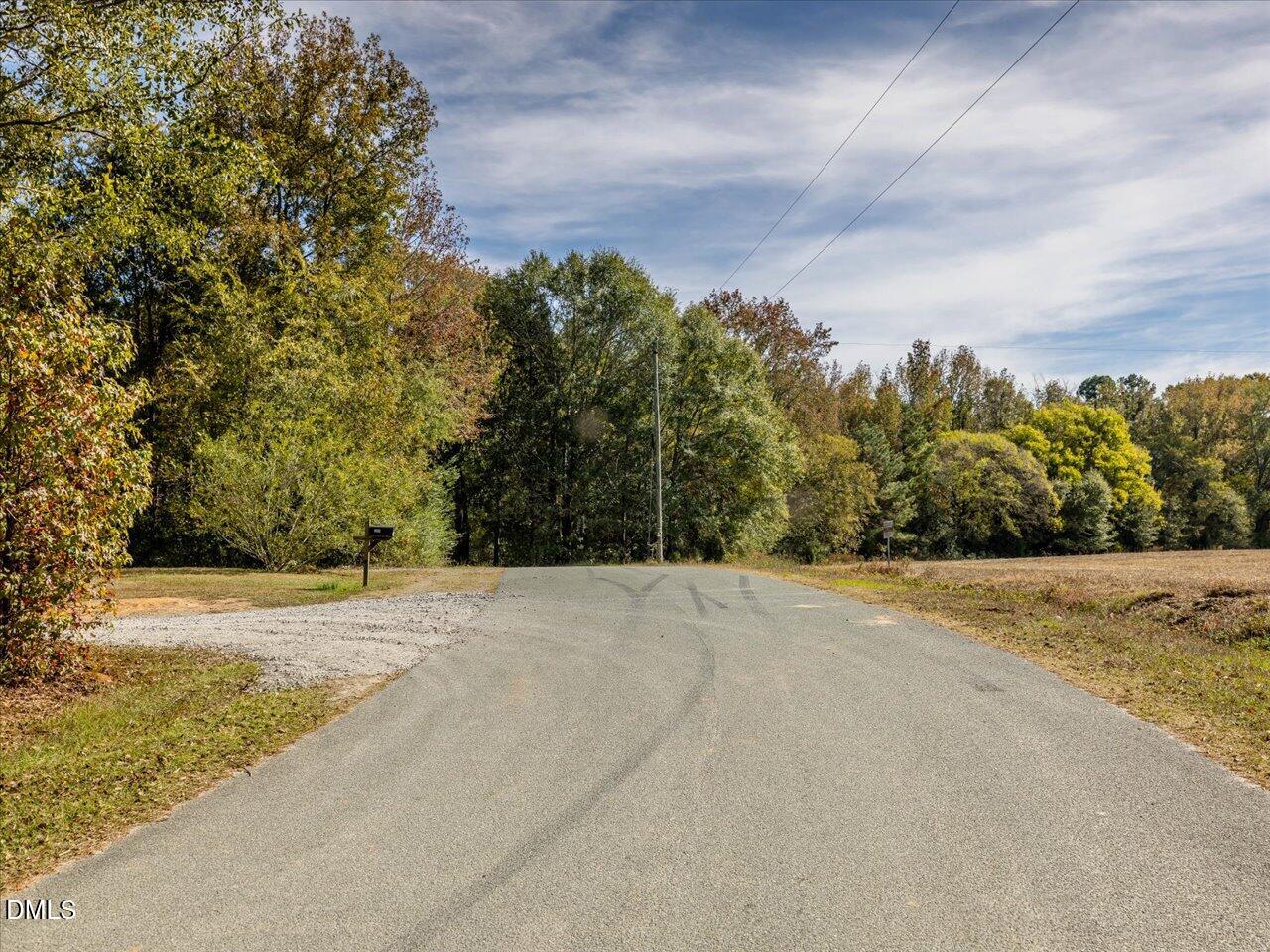 465 Wimberly Road Moncure, NC 27559 - Photo 10 of 13 a view of a field with trees in the background