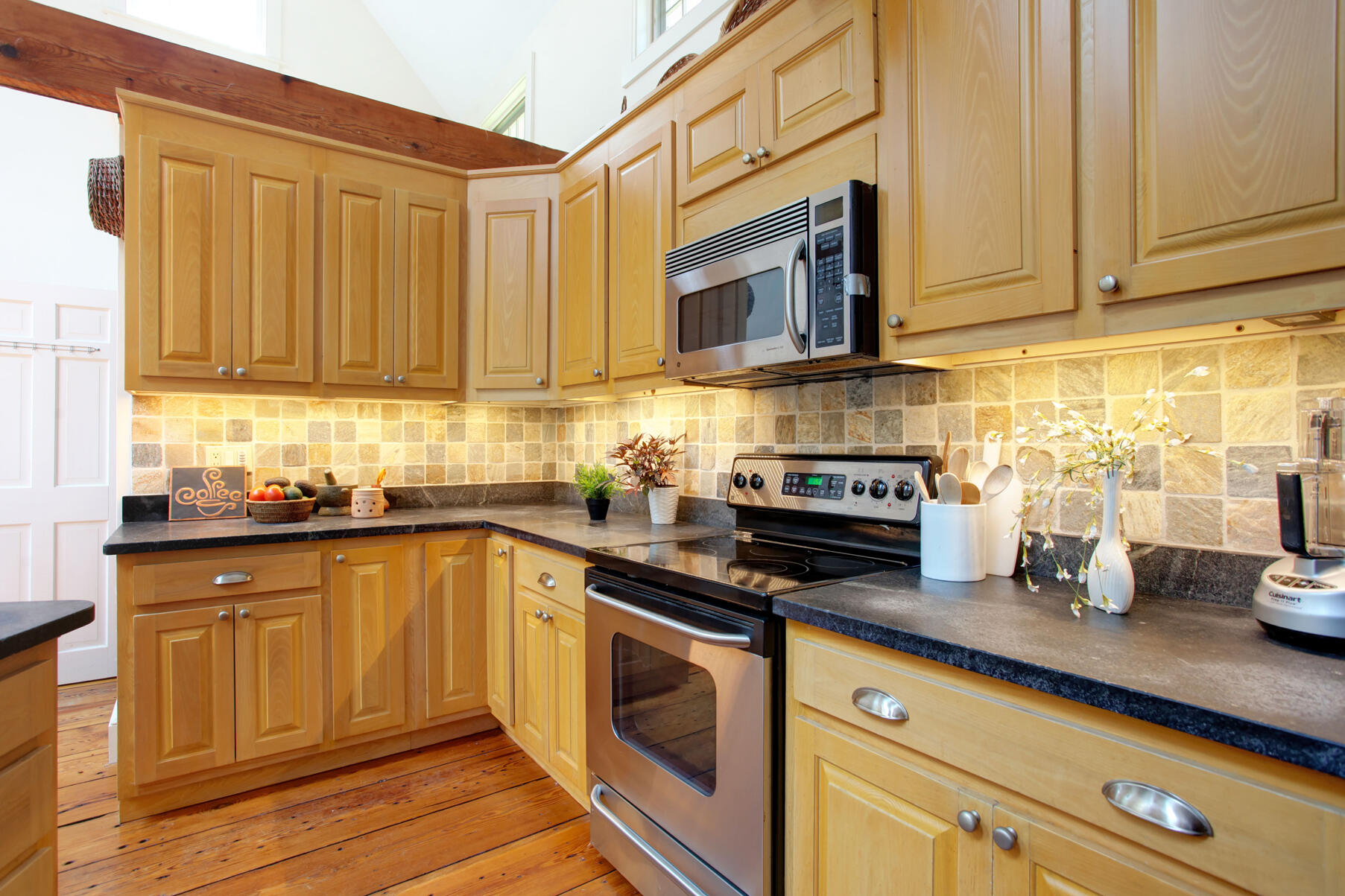 27 Oak Ridge Road East Sandwich, MA 02537 - Photo 24 of 57 a kitchen with stainless steel appliances granite countertop a sink a stove cabinets counter space and a window