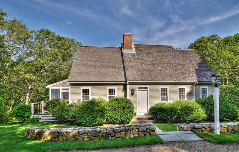 27 Oak Ridge Road East Sandwich, MA 02537 - Photo 54 of 57 a front view of a house with a yard