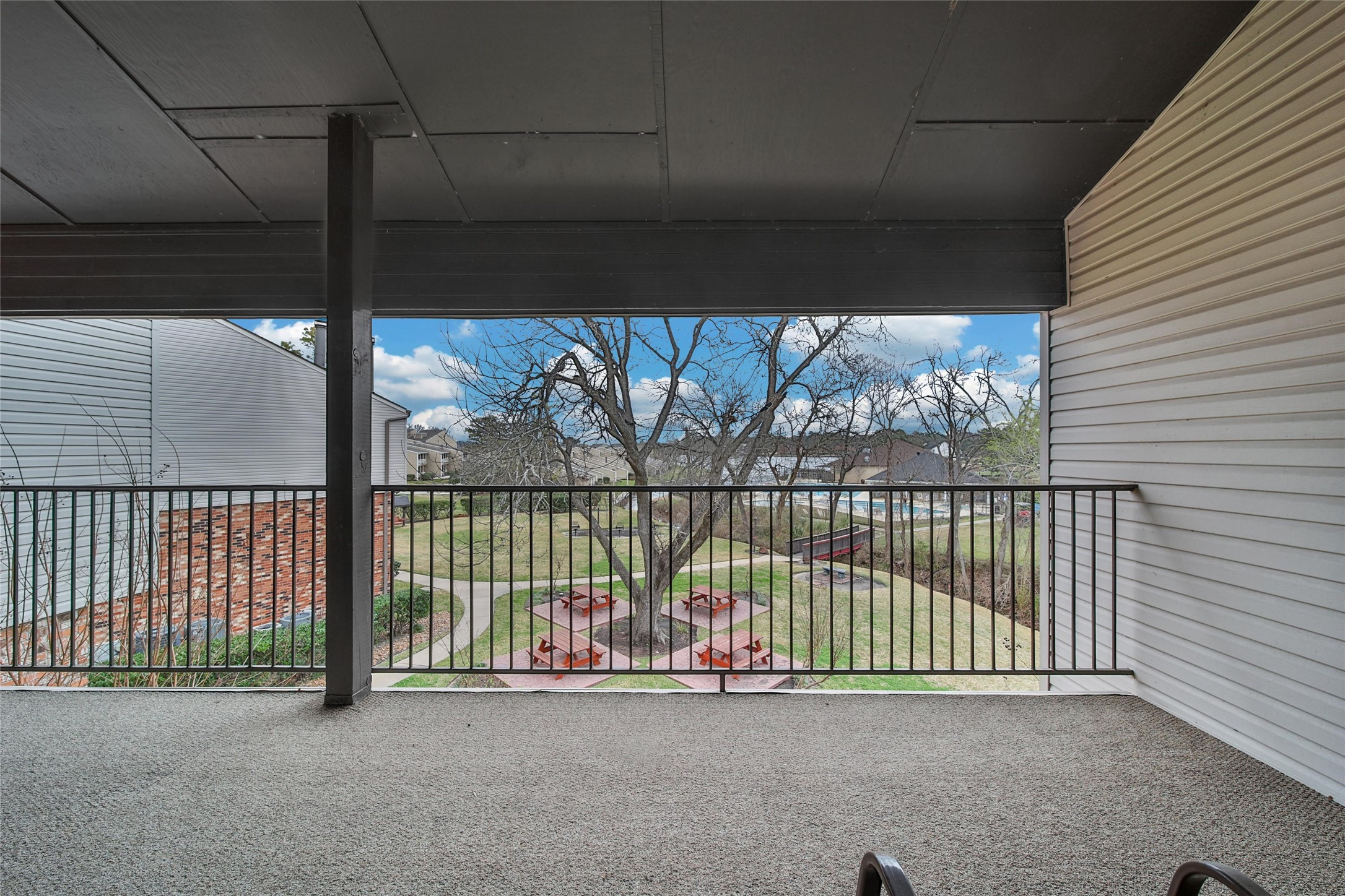 1000 April Sound Boulevard Conroe, TX 77356 - Photo 15 of 46 a view of a porch with a tv