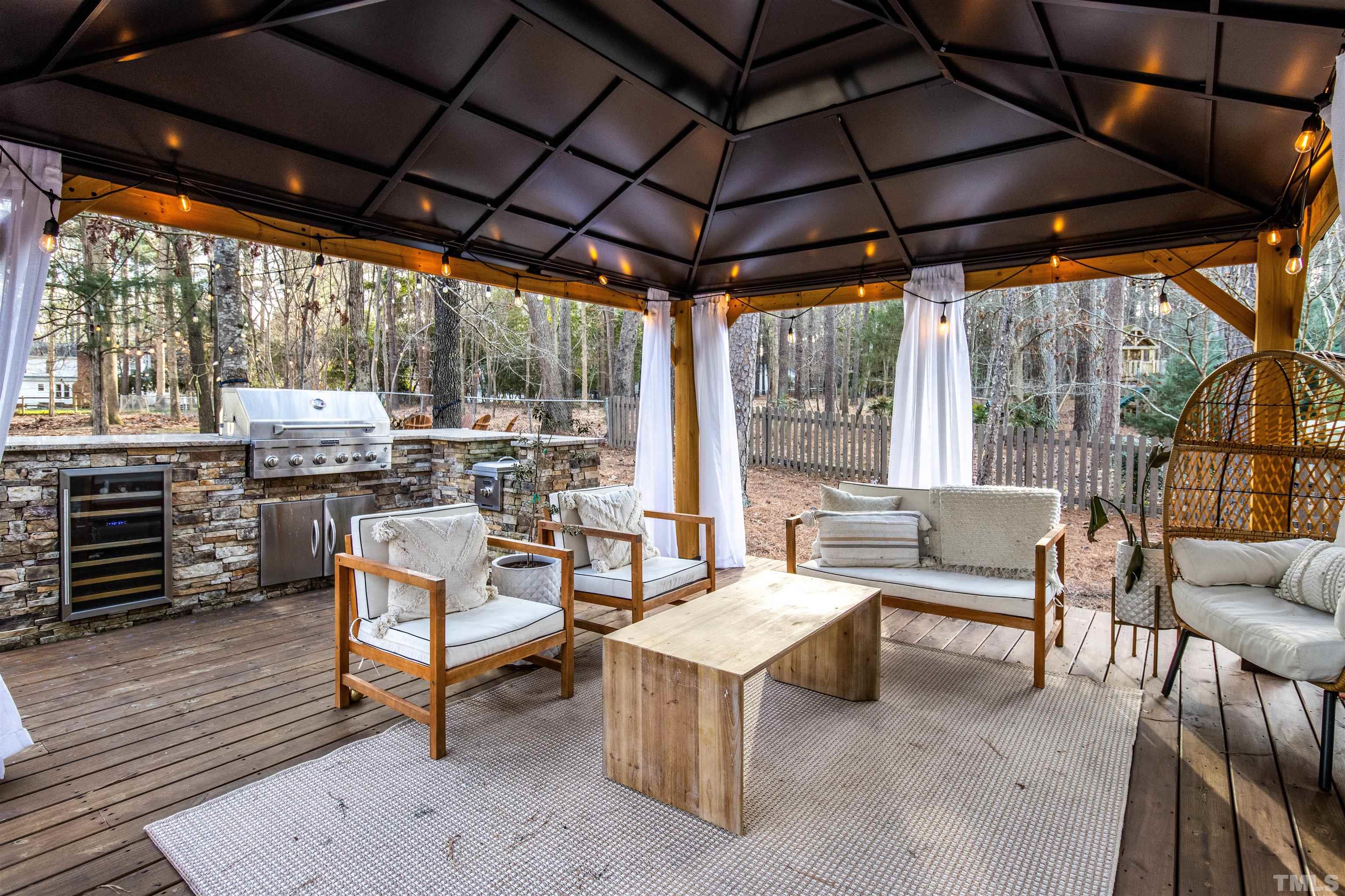 132 Benedict Lane Raleigh, NC 27614 - Photo 36 of 39 a outdoor space with lots of tables a patio and a garden view