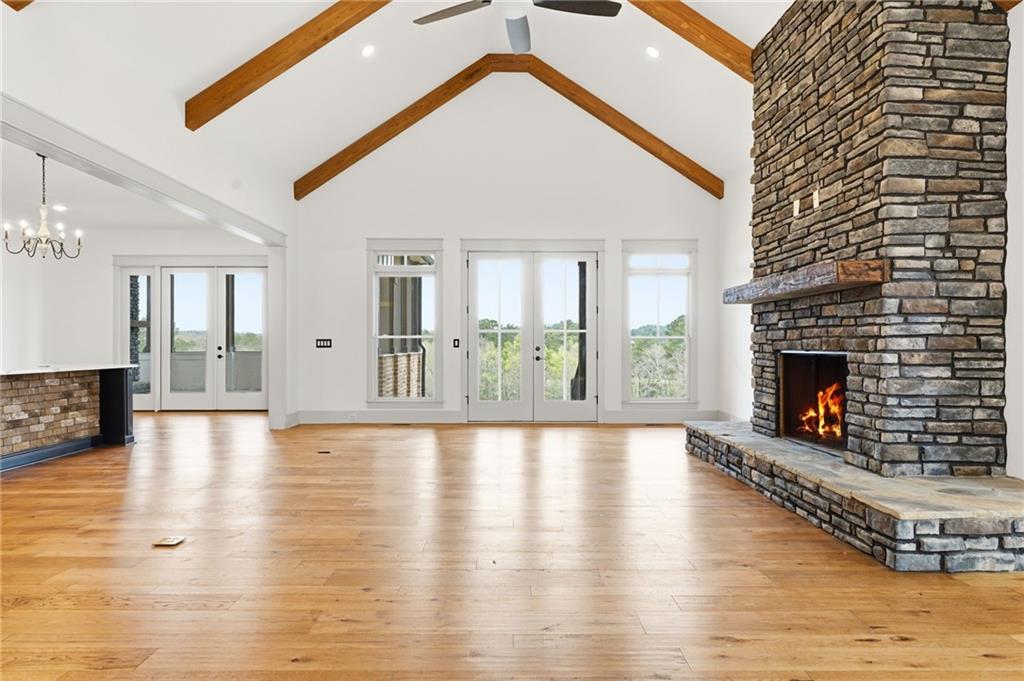 738 Overlook Trail Acworth, GA 30101 - Photo 12 of 94 a view of an empty room with wooden floor and a fireplace