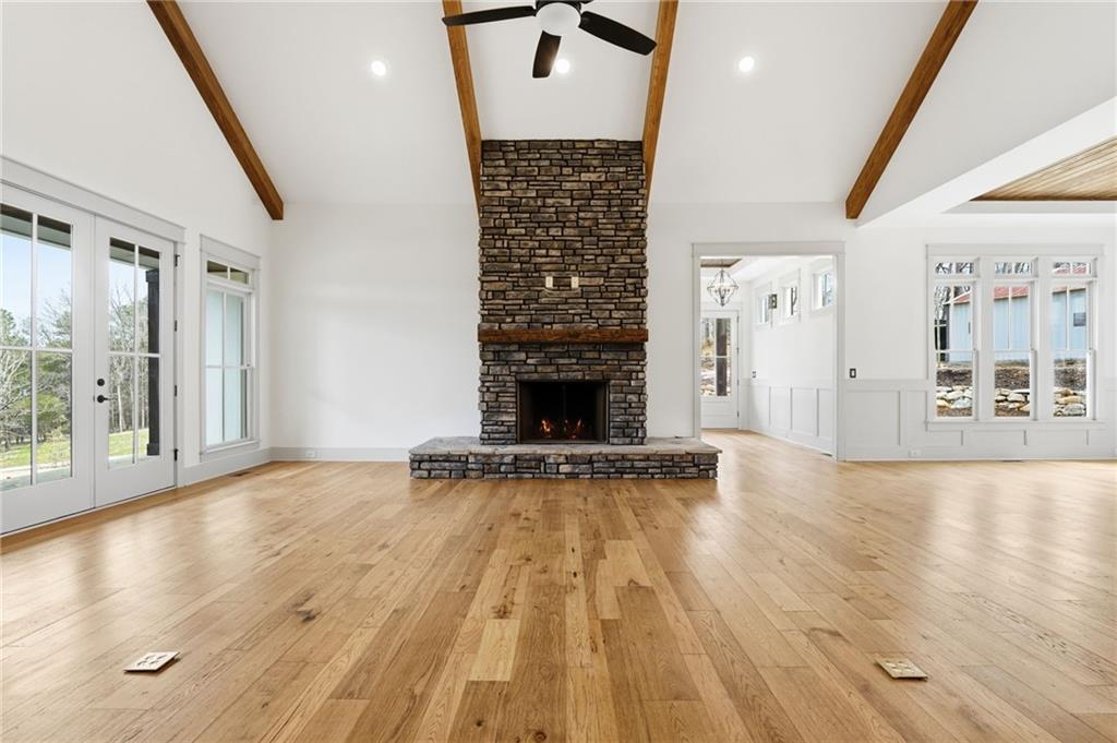 738 Overlook Trail Acworth, GA 30101 - Photo 14 of 94 a view of an empty room with wooden floor and a fireplace