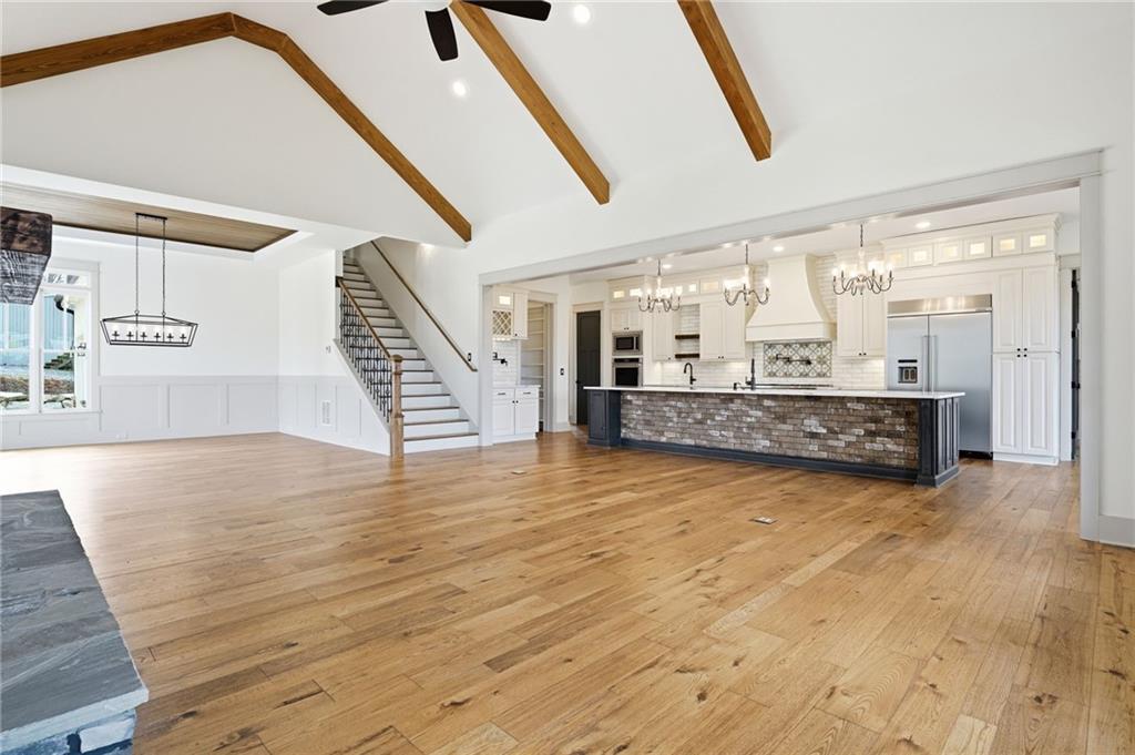 738 Overlook Trail Acworth, GA 30101 - Photo 16 of 94 a view of an empty room with wooden floor and windows