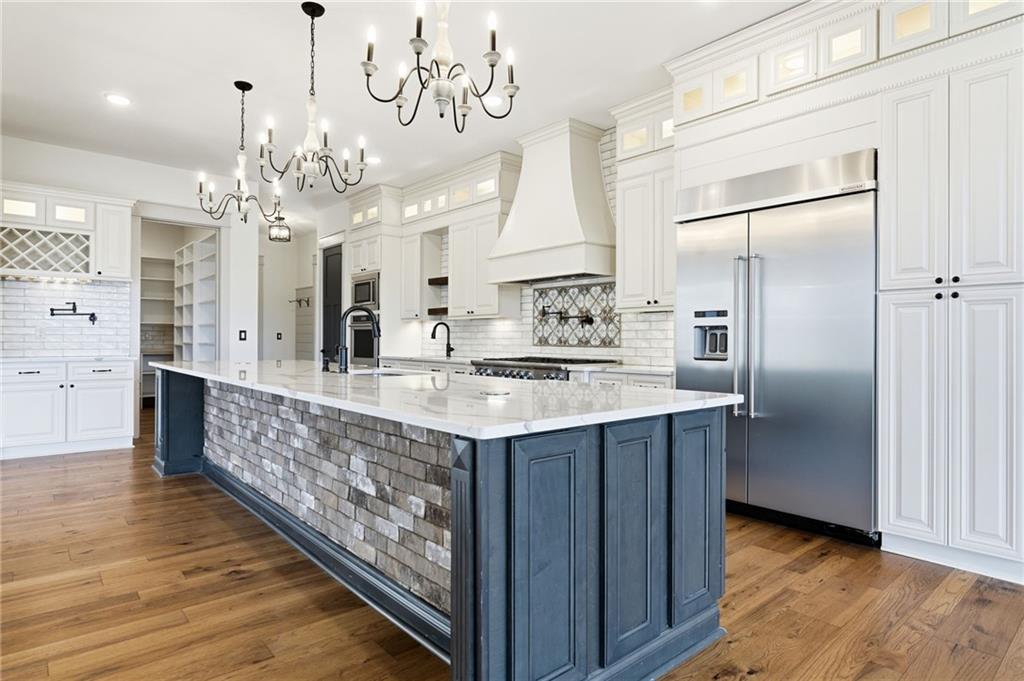 738 Overlook Trail Acworth, GA 30101 - Photo 20 of 94 a large kitchen with a large counter top a sink stainless steel appliances and cabinets