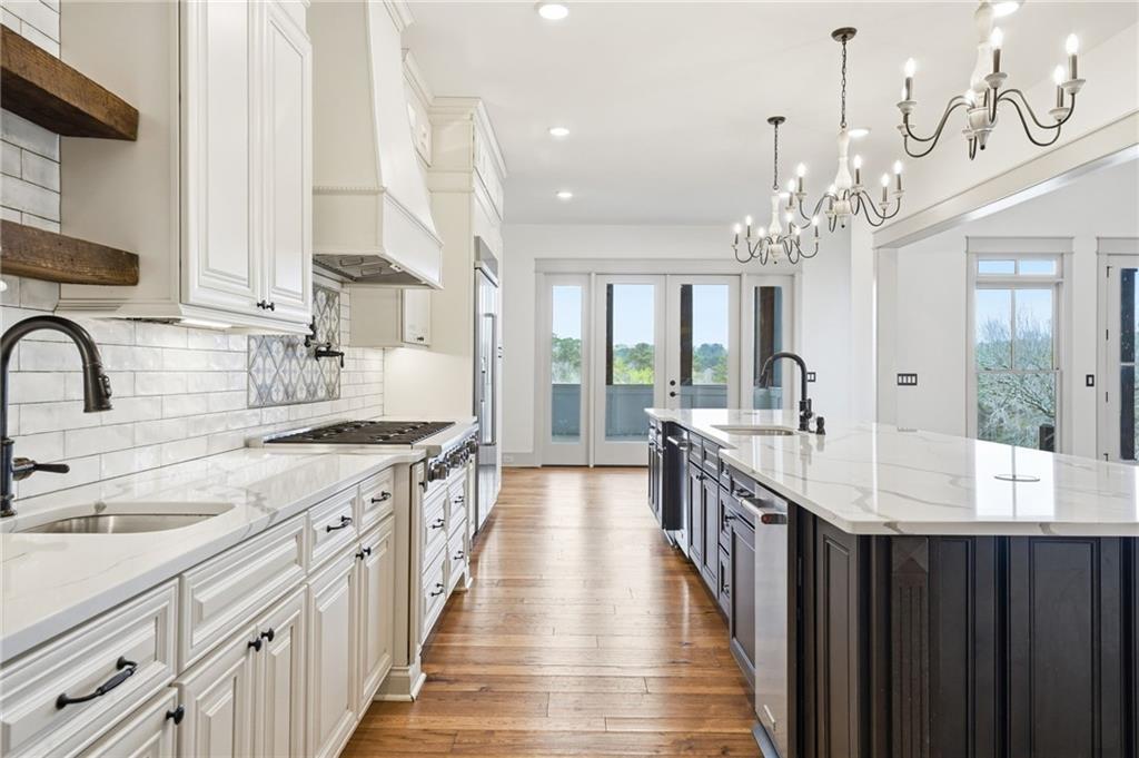 738 Overlook Trail Acworth, GA 30101 - Photo 26 of 94 a kitchen with kitchen island granite countertop lots of counter top space and sink