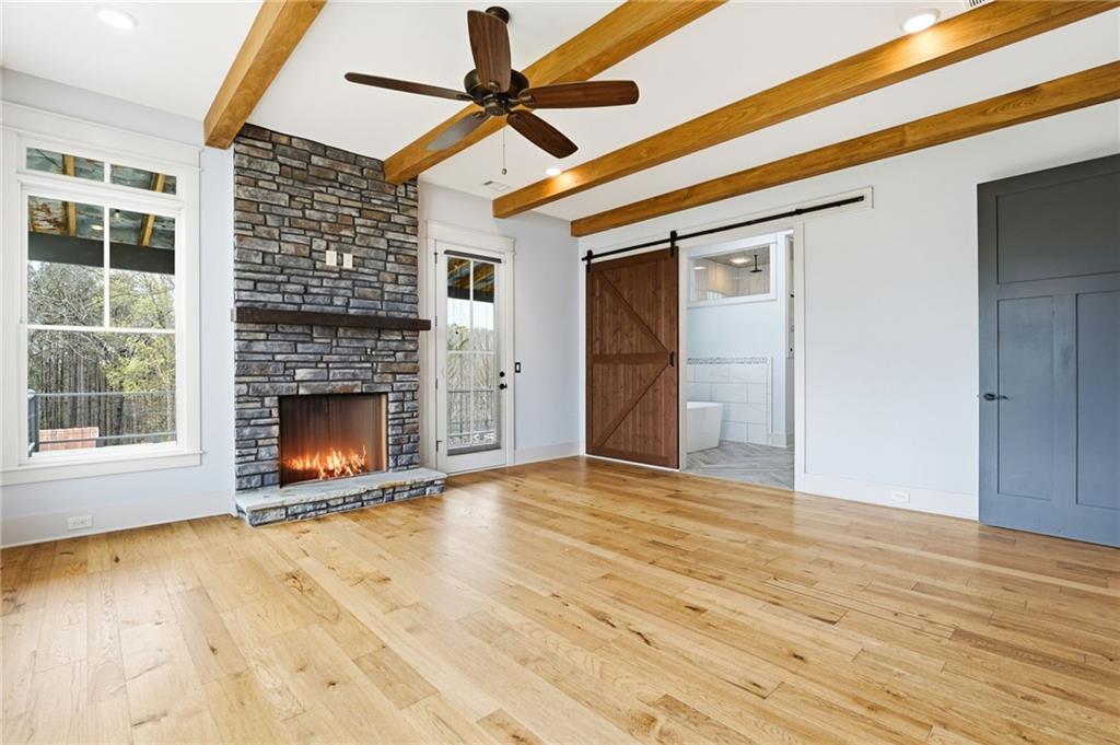 738 Overlook Trail Acworth, GA 30101 - Photo 29 of 94 a view of an empty room with a fireplace and a window