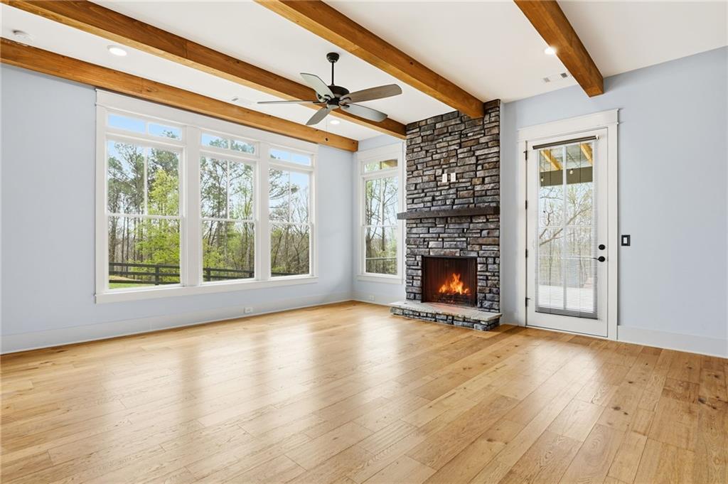 738 Overlook Trail Acworth, GA 30101 - Photo 31 of 94 a view of an empty room with wooden floor fireplace and a window