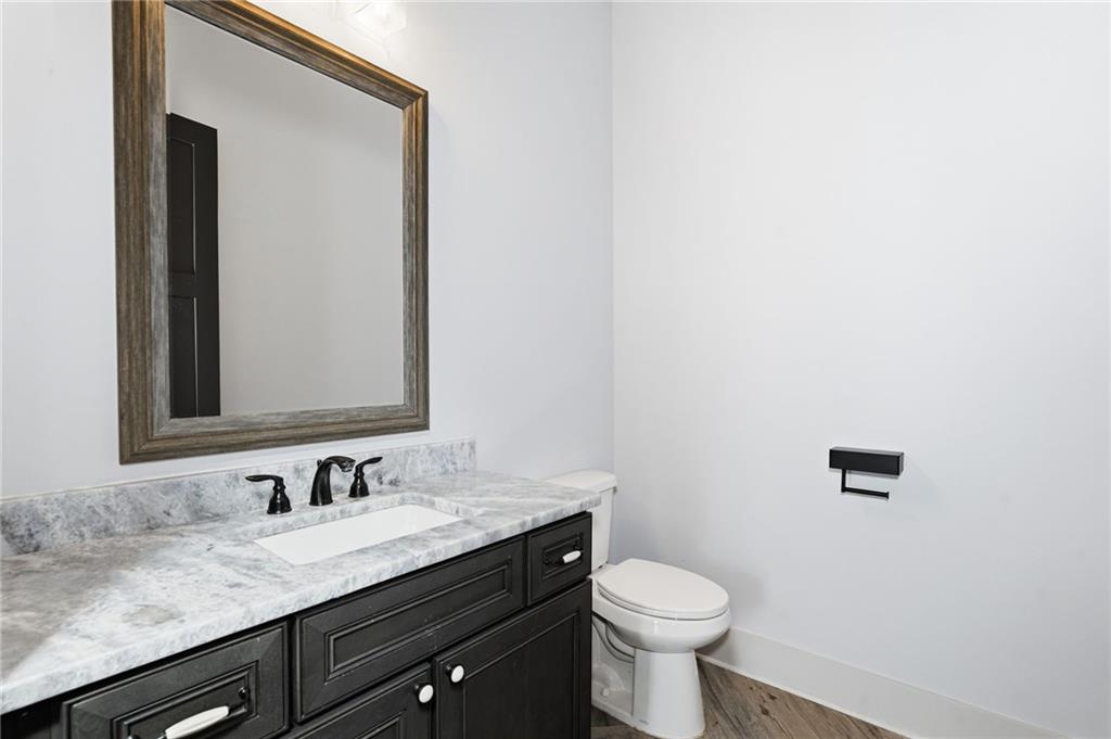 738 Overlook Trail Acworth, GA 30101 - Photo 37 of 94 a bathroom with a granite countertop sink and a toilet
