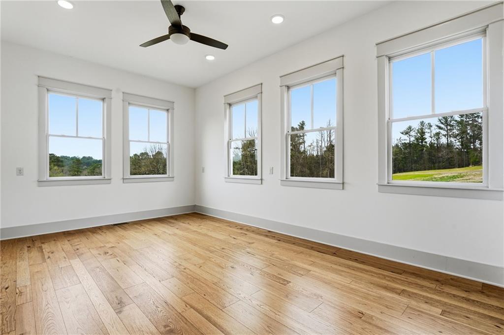 738 Overlook Trail Acworth, GA 30101 - Photo 44 of 94 a view of an empty room with a window and wooden floor
