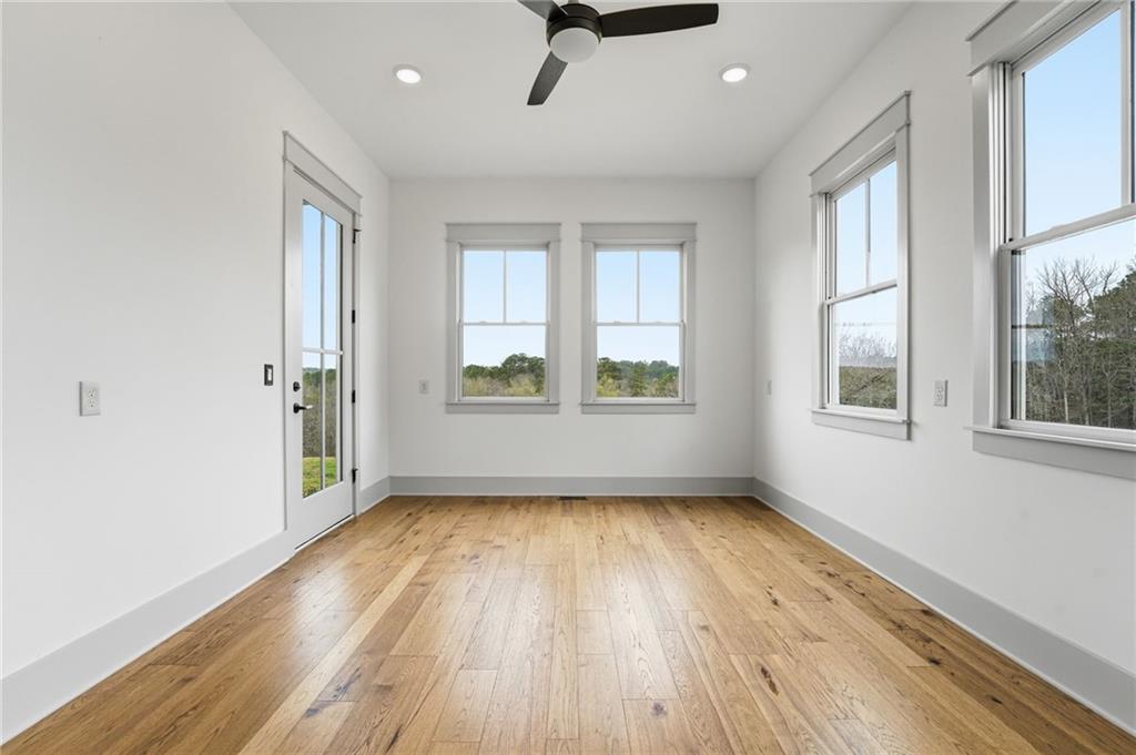 738 Overlook Trail Acworth, GA 30101 - Photo 45 of 94 an empty room with wooden floor and windows