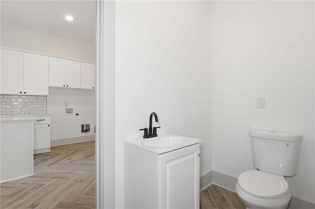 738 Overlook Trail Acworth, GA 30101 - Photo 55 of 94 a bathroom with a toilet a sink and mirror