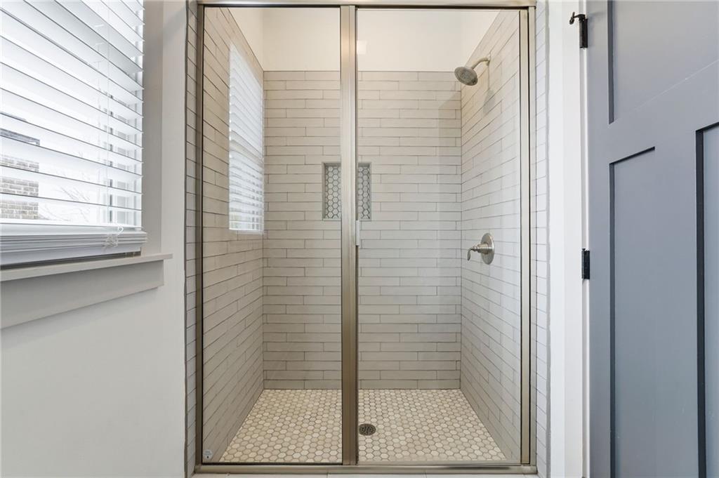 738 Overlook Trail Acworth, GA 30101 - Photo 69 of 94 a bathroom with a glass shower door