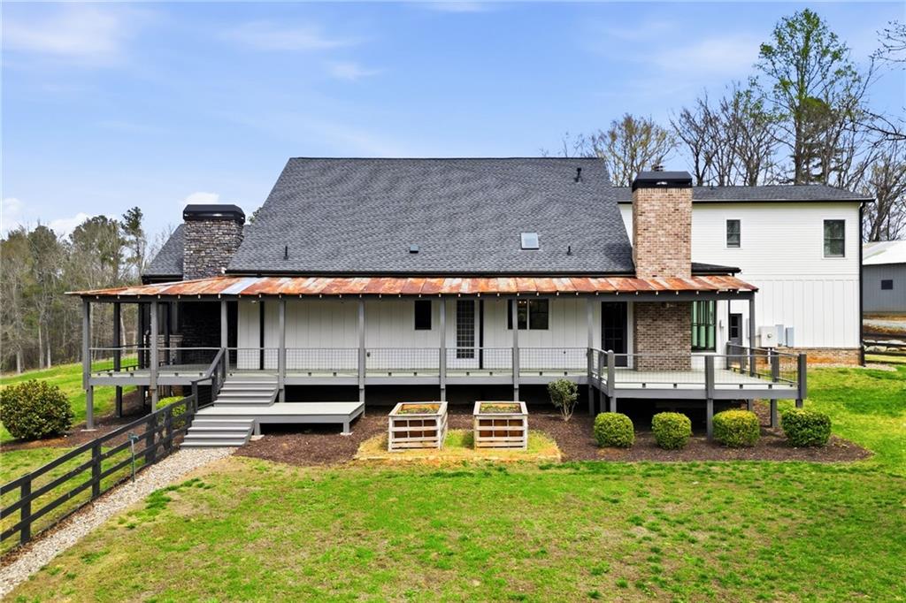 738 Overlook Trail Acworth, GA 30101 - Photo 78 of 94 a front view of a house with a yard table and chairs
