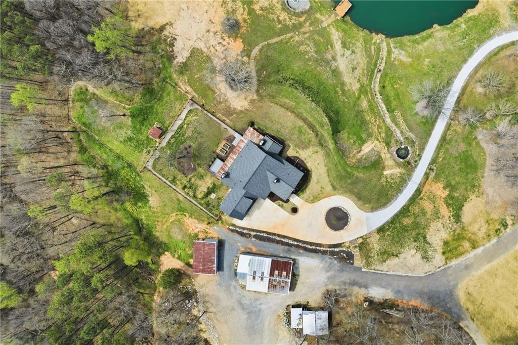 738 Overlook Trail Acworth, GA 30101 - Photo 87 of 94 an aerial view of a house with a yard and large trees