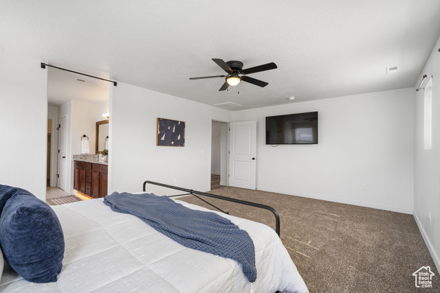 3456 South Linden Way Syracuse, UT 84075 - Photo 20 of 50 Primary bedroom with light colored carpet, baseboards, ceiling fan, and connected bathroom