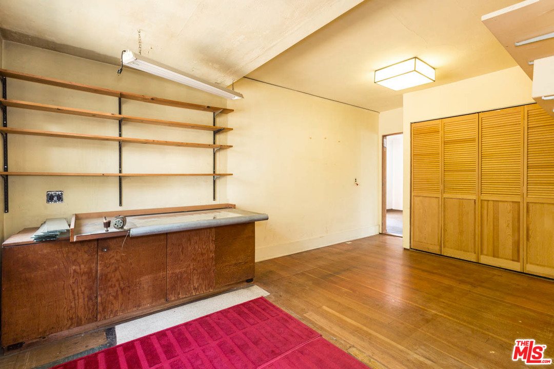 2300 Edgewater Terrace Los Angeles, CA 90039 - Photo 21 of 39 a room with gym equipment and wooden floor