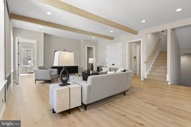 a living room with furniture and a window with outer view
