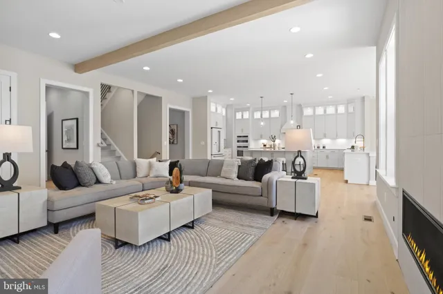 a spacious bedroom with a bed and wooden floor