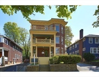 104 Walnut Street, Unit 2 Brookline, MA 02445 - Photo 2 of 4 a front view of a house with a yard